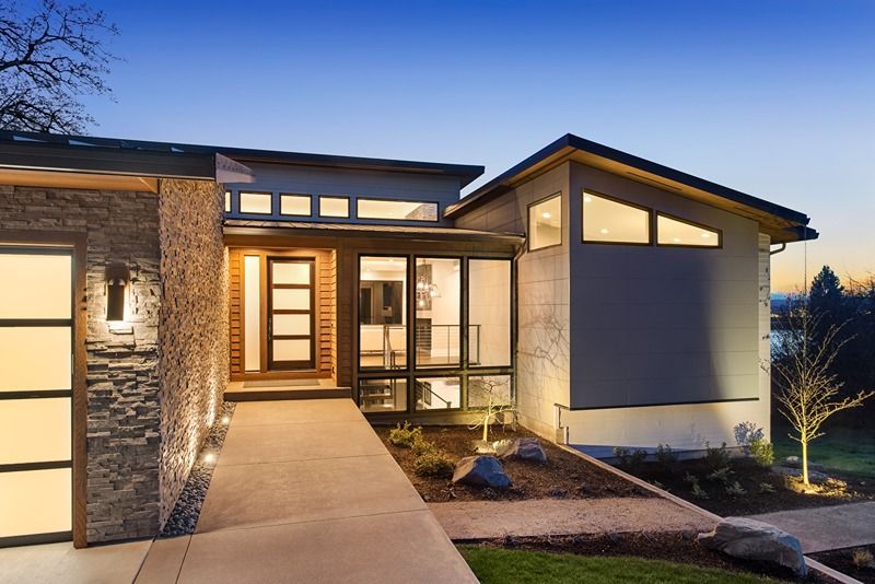 Beautiful_modern_style_luxury_home_at_sunset,_featuring_entrance_and_elegant_design