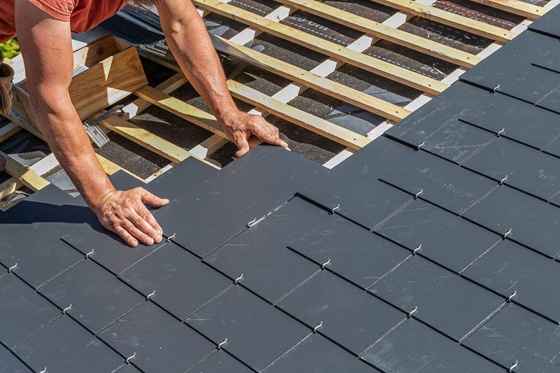 Professional_roof_workers_installing_roof_for_a_old_house